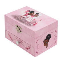 Pink music box with a image of Nia Ballerina who is a black ballerina sitting down at a dressing table. Side view of music box.